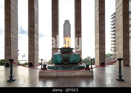 ROSARIO, ARGENTINA - MARCH 12, 2021: Eternal flame in the Triumphal Propylaea of the Homeland and main tower. National Flag Monument located at Rosa Stock Photo