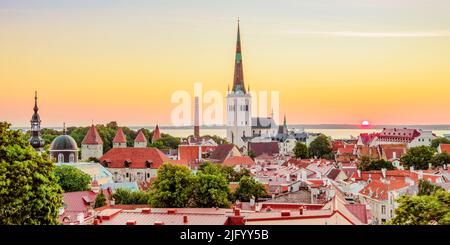 View over the Old Town towards St. Olaf's Church at sunrise, UNESCO World Heritage Site, Tallinn, Estonia, Europe Stock Photo