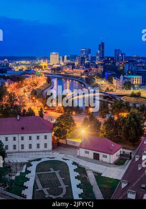 View over Neris River towards Snipiskes, New City Centre, dusk, Vilnius, Lithuania, Europe Stock Photo
