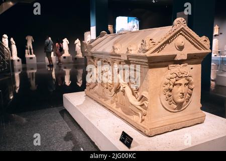 28 May 2022, Antalya, Turkey: Sarcophagus with carved bas-relief in the Archaeological Museum of Antalya. Ancient Lycian burial ceremony and tombs Stock Photo