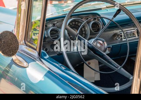 Andover, MA, US-June 26, 2022: Close-up view of the steering wheel in a blue 1950s - 1960s era Chevrolet BelAir classic car. Stock Photo