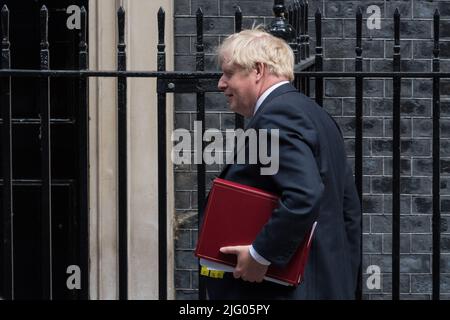 London, UK. 6th July, 2022.  British Prime Minister Boris Johnson leaves 10 Downing Street for the Houses of Parliament to attend the weekly Prime Minister's Questions followed by an appearance in front of the Liaison Committee. Yesterday saw resignations of Chancellor Rishi Sunak and Health Secretary Sajid Javid from the government over appointment of Chris Pincher as a deputy chief whip by Prime Minister Boris Johnson despite being informed about a misconduct complaint against the MP in 2019. Credit: Wiktor Szymanowicz/Alamy Live News Stock Photo