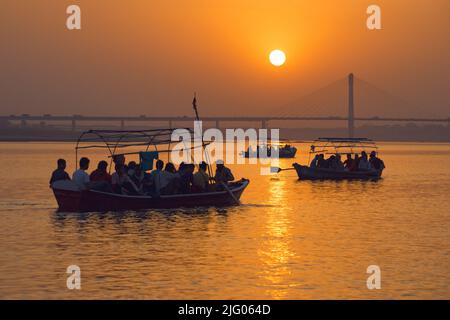 Prayagraj ,21, March, 2016:Panoramic view of setting Sun and boats reflection in river Ganga at Magh Mela fair, ,Prayagraj, Uttar Pradesh,India, Stock Photo