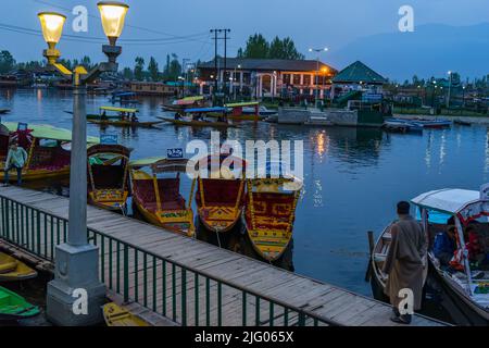 Srinagar ,11,April, 2016; Dal Lake in evening with reflections of Shikaras boats in background ,Srinagar, Kashmir, India Stock Photo