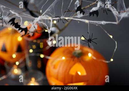 pumpkins, candles and halloween decorations Stock Photo