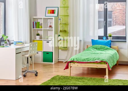 kid's room interior with bed, table and bookcase Stock Photo