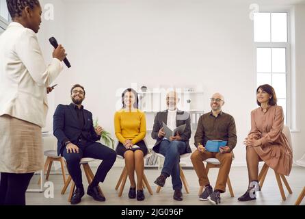 Black female speaker make presentation in office Stock Photo