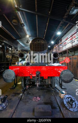 A steam engine undergoing a rebuild in the engine sheds at Grosmont Stock Photo