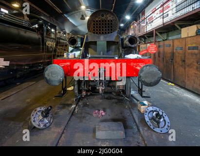 A steam engine undergoing a rebuild in the engine sheds at Grosmont Stock Photo