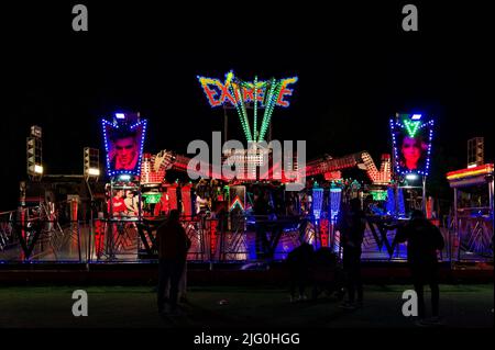 The EXTREME fairground ride at night during the annual May fair in Boston Lincolnshire Stock Photo