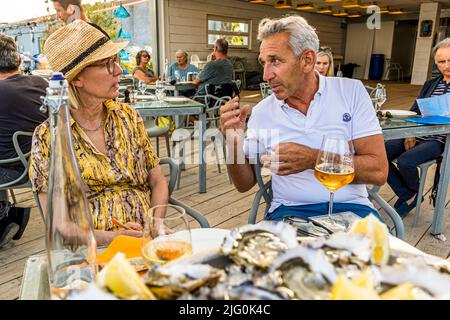 Florent Tarbouriech (r.) in conversation with food journalist Angela Berg at Le St Pierre Tarbouriech beach pavilion
