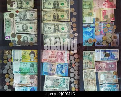collection of different coins from multiple countries around the world ...