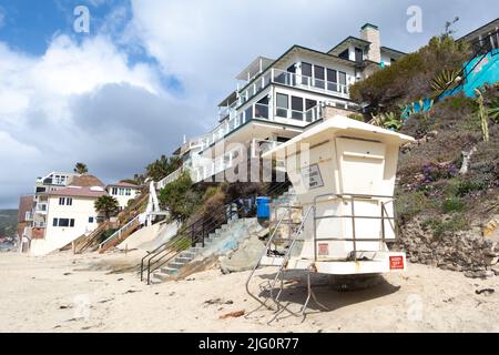 iconic lifeguard hut on beach in front of sea front houses in Laguna beach Southern California USA Stock Photo