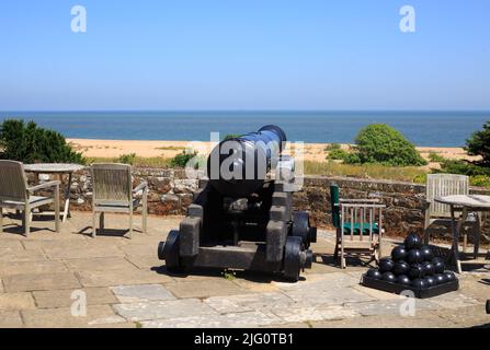 A Wartime Canon at the top of Dover Castle overlooking the English Channel, with a nice pale blue sky. Stock Photo