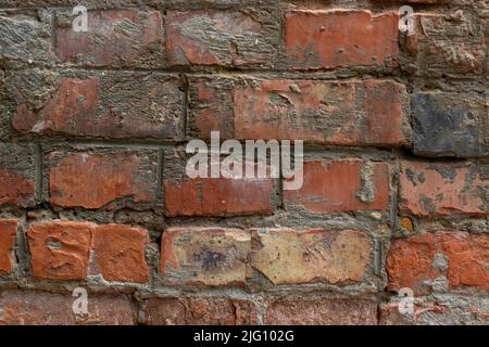 dark, dirty burnt wall, old brick, next to the stove Stock Photo