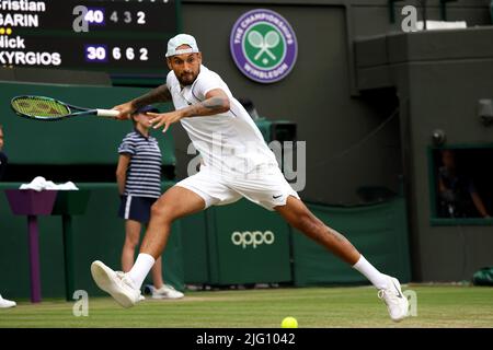 All, UK. 6th July, 2022. Lawn Tennis Club, Wimbledon, London, United Kingdom: Australia's Nick Kyrgios swings wide for a forehand during his quarterfinal match against Cristian Garin today at Wimbledon. Credit: Adam Stoltman/Alamy Live News Stock Photo