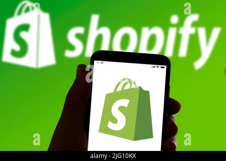 The online payment and banking app Shopify logo is seen on the screen of a mobile phone in Barcelona, Spain on July 06, 2022 Stock Photo