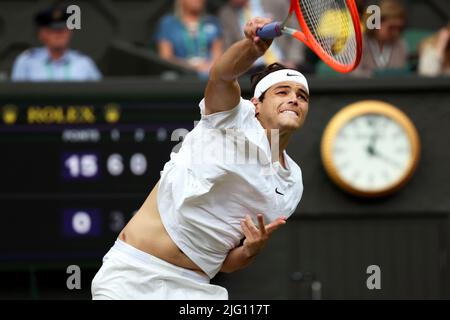 All, UK. 6th July, 2022. Lawn Tennis Club, Wimbledon, London, United Kingdom: Taylor Fritz of the United States serving to number one seed Rafael Nadal during their quarterfinal match today at Wimbledon. Credit: Adam Stoltman/Alamy Live News Stock Photo