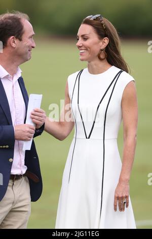 The Duchess of Cambridge talks to Andrew Tucker, the Duke of Cambridge's polo manager at the Out-Sourcing Inc charity polo match at Guards Polo Club, Smiths Lawn, Windsor. The match is to raise funds and awareness for ten charities supported by the Duke and Duchess of Cambridge. Picture date: Wednesday July 6, 2022. Stock Photo