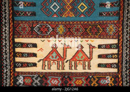 Colorful Oriental Mosaic Carpet With Traditional Folk Animal Ornament. Patterned Carpet. Part Of Oriental Carpet. Closeup Picture Of Handmade Woven Stock Photo