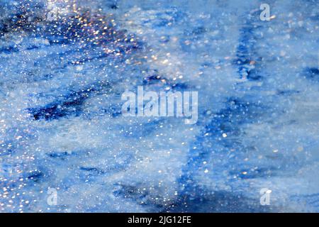 Colored canvas with marble texture, golden smudges, sparkles blue background. Abstract background Stock Photo