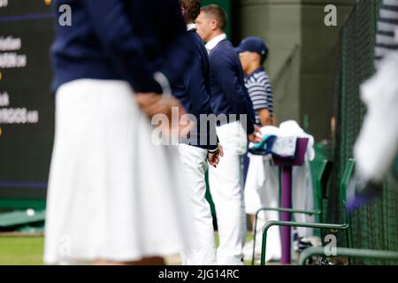 London, UK, 6th July 2022: Linesmen and women´s stand on the court at the All England Lawn Tennis and Croquet Club in London. Credit: Frank Molter/Alamy Live news Stock Photo