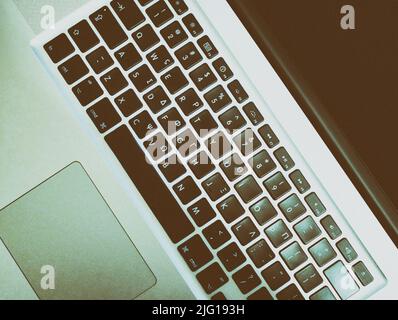 Keyboard of a laptop. Laptop close up from top Stock Photo
