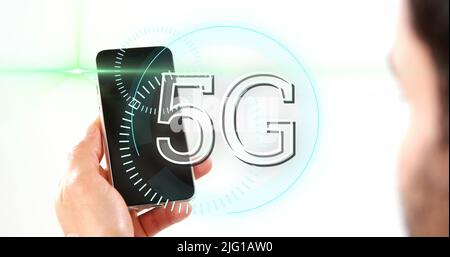 5G text on circles against man using smartphone Stock Photo
