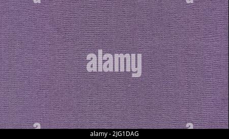 Knitted textured purple fabric background. Beautiful violet fabric texture. Stock Photo