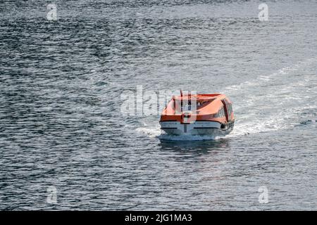 Hoonah, AK - 7 June 2022: Viking Orion tender boat returning to cruise ship in Alaska Stock Photo