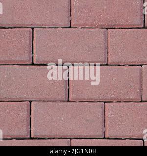 Seamless texture of masonry road made of dark pink brick. Top view Stock Photo