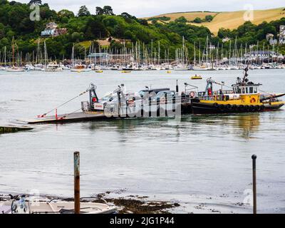Dartmouth to Kingswear tug guided Lower ferry coming in to Dartmouth slip Stock Photo