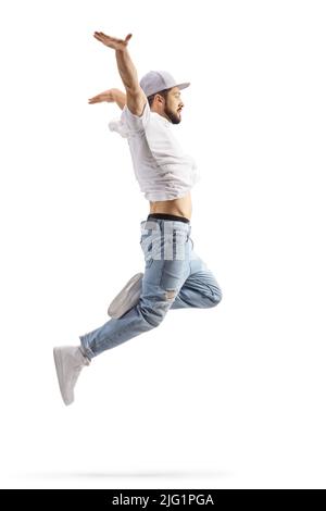 Full length profile shot of a male dancer in a jumping pose isolated on white background Stock Photo