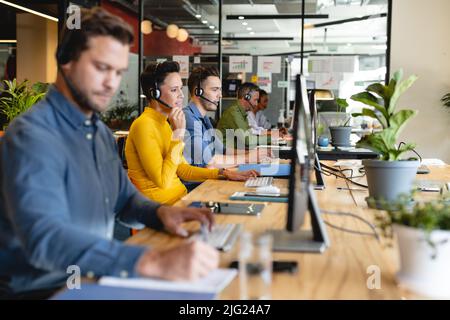 Multiracial male and female customer service executives working in office Stock Photo