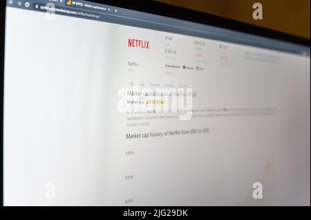 Netflix Corporation's market capitalization. Web page on PC screen. Netflix is an American entertainment company, a streaming service for movies and T Stock Photo