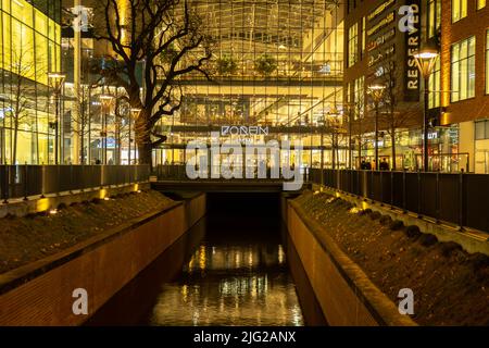 Gdansk Poland - April 2022. Forum gallery shopping mall at night. Modern shopping and entertainment centre. Architecture in the city center of Gdansk is the historical capital of Polish Pomerania with medieval old town architecture Stock Photo