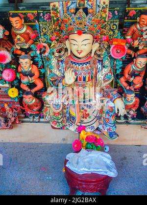 Yak butter sculptures include all kinds of Buddha figures, portraits, flowers, trees, and pavilions made of a mixture of white butter mineral dye. Stock Photo