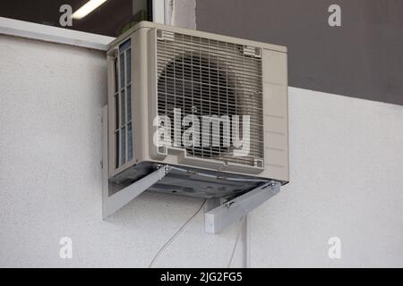 old air conditioning refrigeration unit outside the building Stock Photo