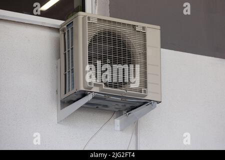 old air conditioning refrigeration unit outside the building Stock Photo