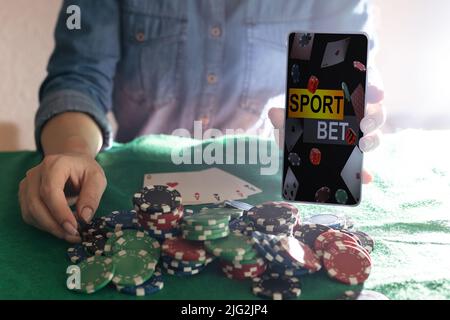 inscription your bet wins on a smartphone on the poker table. Stock Photo