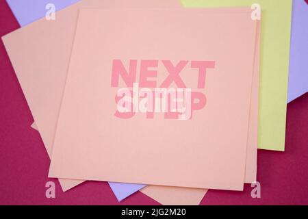 Next Step. Text on adhesive note paper. Event, celebration reminder message. Stock Photo