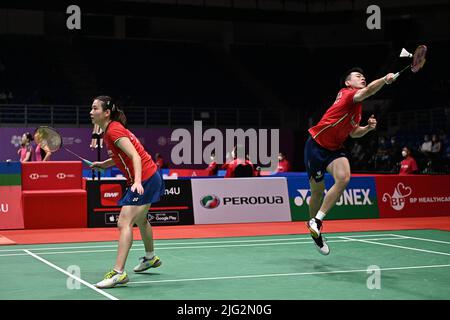 Kuala Lumpur, Malaysia. 7th July, 2022. China's Zheng Siwei(R)/Huang Yaqiong compete during the mixed doubles round of 16 match against Malaysia's Chan Peng Soon/Cheah Yee See at Malaysia Masters 2022 in Kuala Lumpur, Malaysia, July 7, 2022. Credit: Chong Voon Chung/Xinhua/Alamy Live News Stock Photo