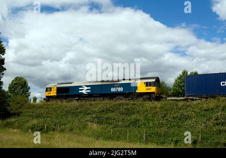 GBRf class 66 diesel locomotive No. 66789 'British Rail 1948-1997' pulling a freightliner train, Warwickshire, UK Stock Photo