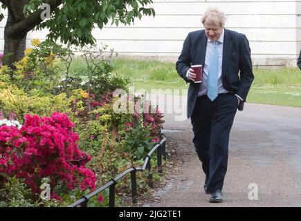 File photo dated 05/05/20 of Prime Minister Boris Johnson takes a morning walk in St James' Park in London before returning to Downing Street, as the UK entered a seventh week of lockdown. Boris Johnson will publicly announce his resignation later today, likely before lunchtime, the BBC is reporting. Issue date: Thursday July 7, 2022. Stock Photo