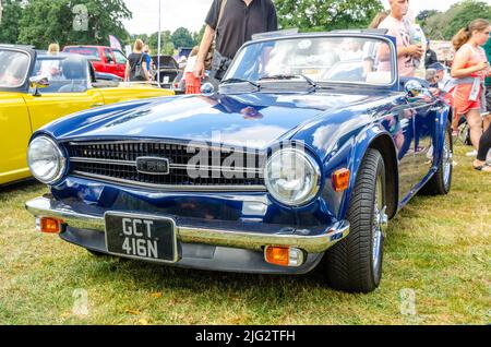 Front view of a 1974 Triumph TR6 in blue at The Berkshire Motor Show in Reading, UK Stock Photo