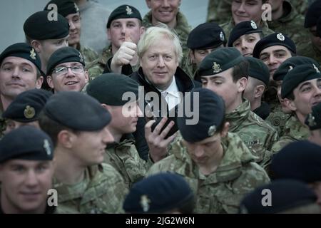 File photo dated 21/12/19 of Prime Minister Boris Johnson addressing British soldiers after serving Christmas lunch to the troops stationed in Estonia during a one-day visit to the Baltic country. D Boris Johnson will publicly announce his resignation later today, likely before lunchtime, the BBC is reporting. Issue date: Thursday July 7, 2022. Stock Photo