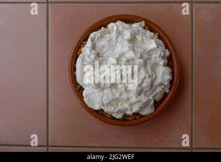 Fluffy whipped creams tops off a banoffee pie Stock Photo