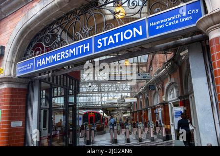 London- June 2022: Entrance to Hammersmith Station in West London servicing the Circle and the Hammersmith & City Line. Stock Photo