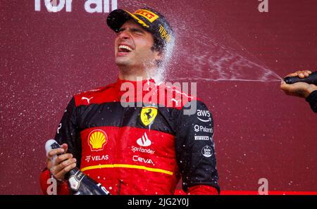 Carlos Sainz celebrates winning his first ever F1 Grand Prix on the podium at the F1 British Grand Prix. Carlos Sainz wins his first F1 race at the Br Stock Photo