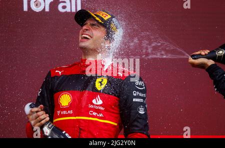 Carlos Sainz celebrates winning his first ever F1 Grand Prix on the podium at the F1 British Grand Prix. Carlos Sainz wins his first F1 race at the Br Stock Photo